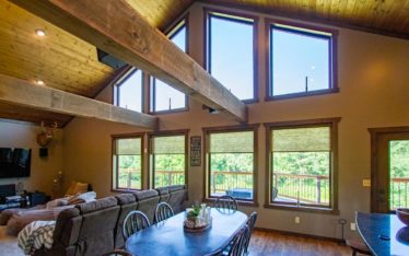 Beautiful window design - 8 Aeris Shape Almond wood color by ProVia. Large picture windows in different shapes for an A-frame house.