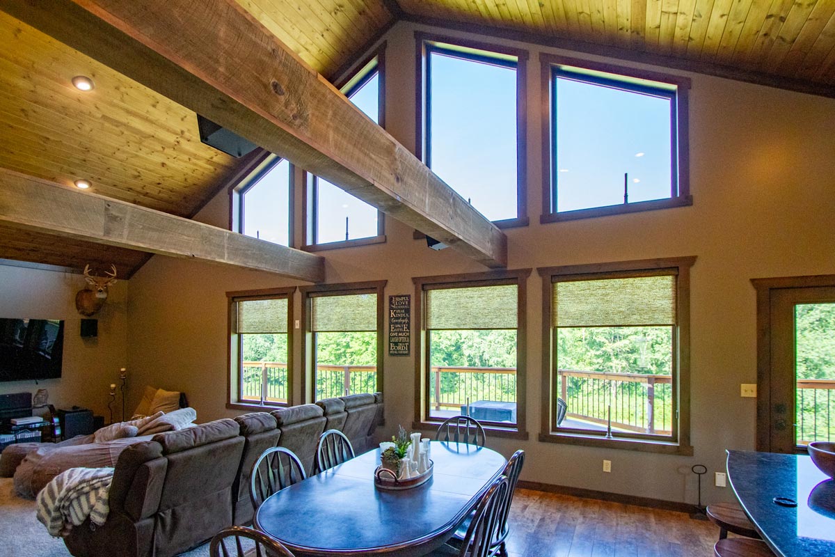 Beautiful window design - 8 Aeris Shape Almond wood color by ProVia. Large picture windows in different shapes for an A-frame house.