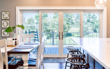 Showing beautiful white french doors with white internal blinds.